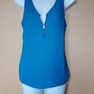 blue women's shirt with zipper and two faux pockets